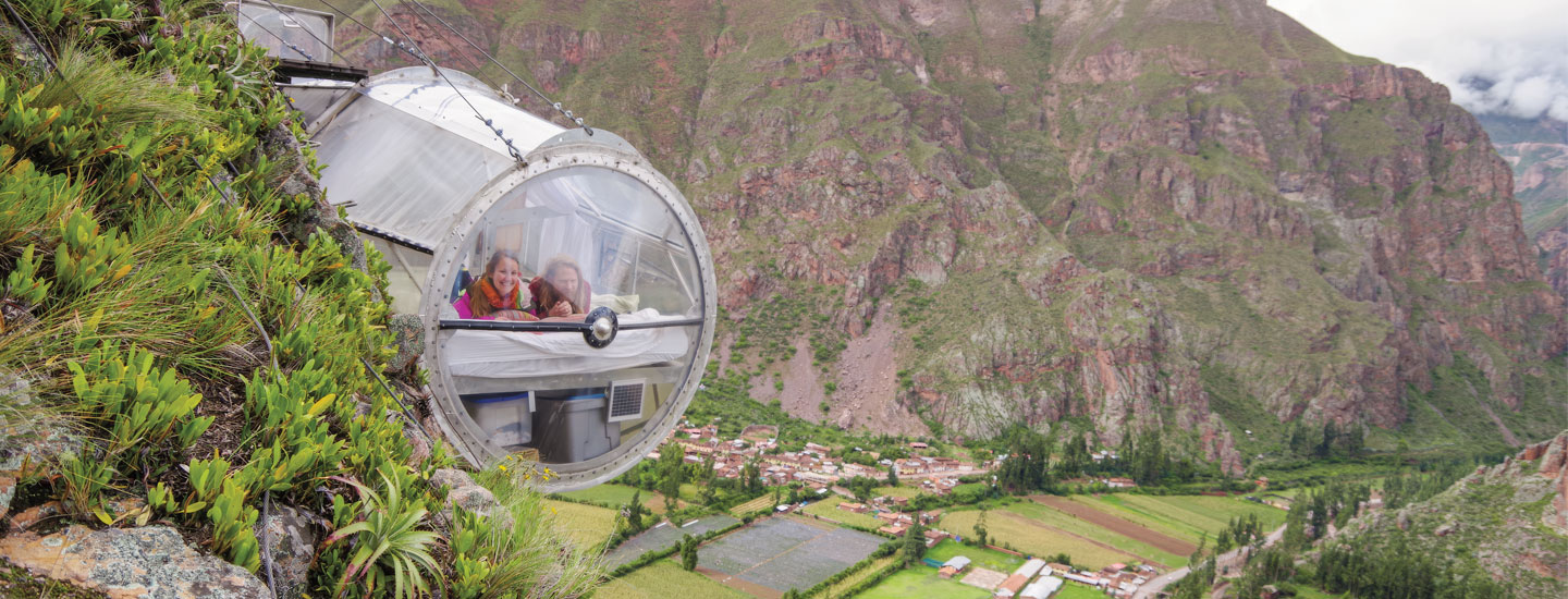 Image of a sphere-like home built on the side of a mountain